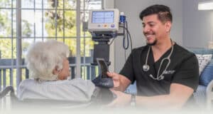 A nurse checking the vitals of an older woman