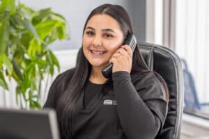 Woman answering the phone at Cypress Ridge