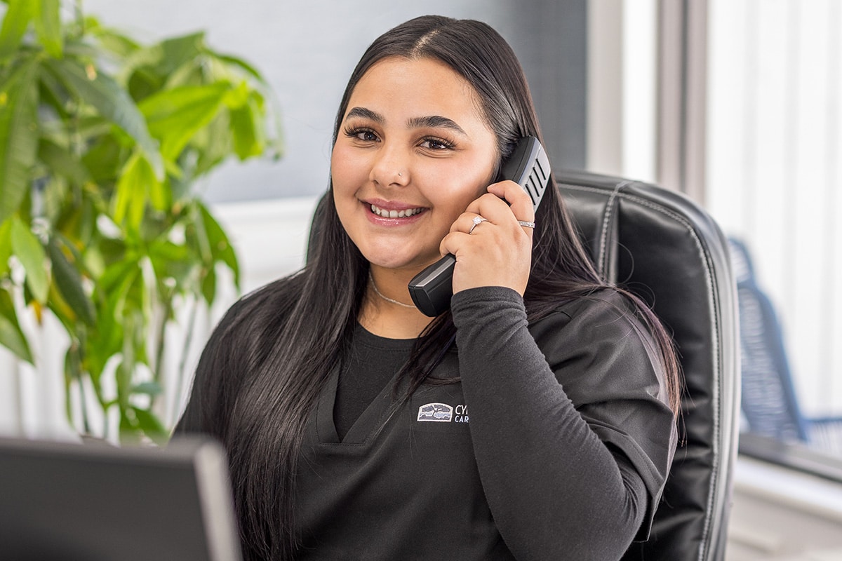 Woman answering the phone at Cypress Ridge