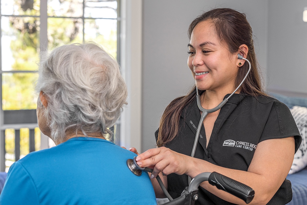 Nurse taking a patients heartbeat at Cypress Ridge