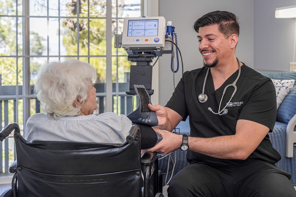 Nurse taking a patients blood pressure at Cypress Ridge