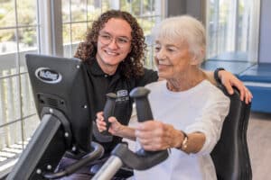 A nurse helping a patient at Cypress Ridge