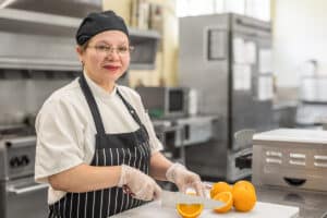 Chef cutting oranges at Cypress Ridge
