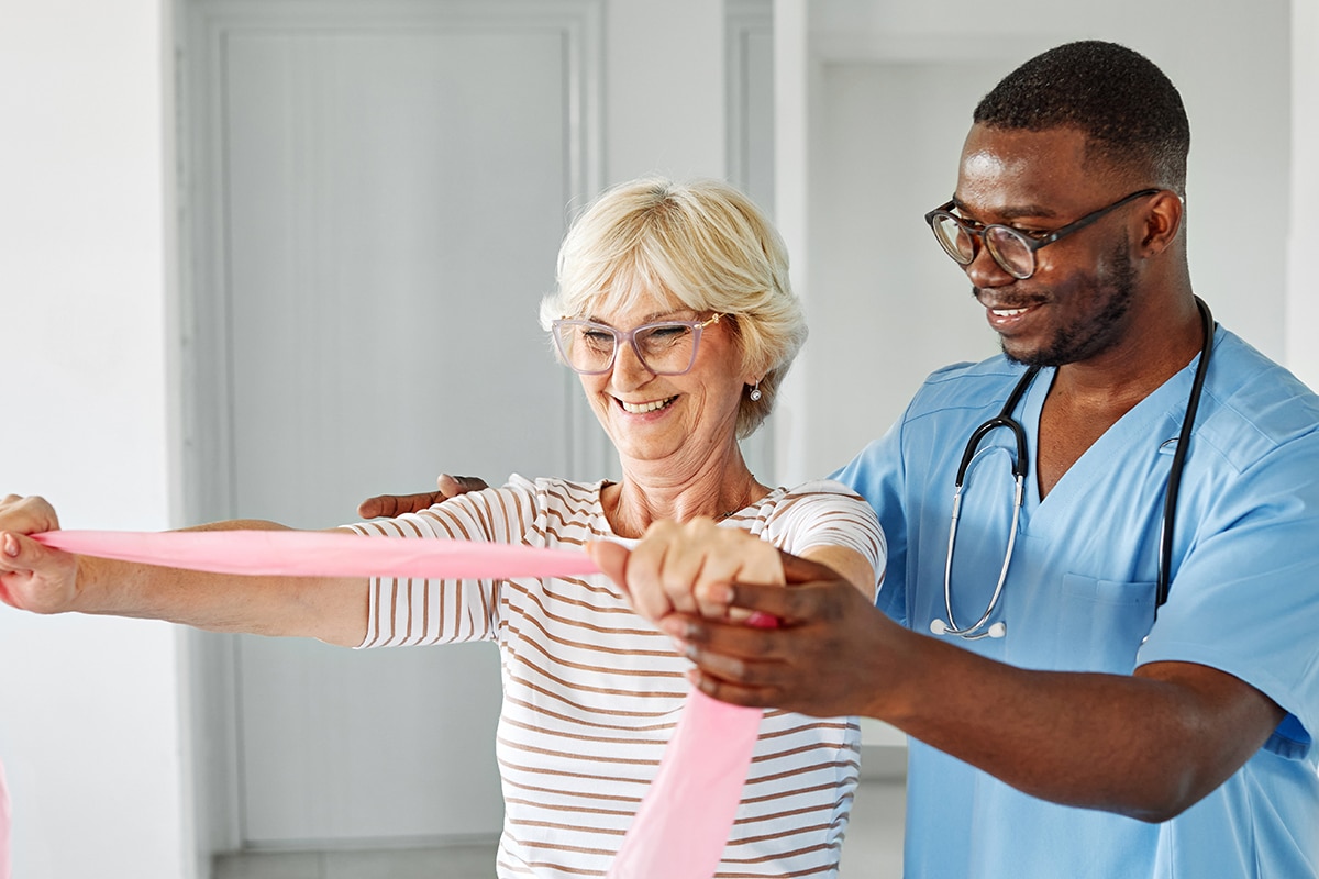 PACS-300x200-rehab2 therapist and senior woman exercising